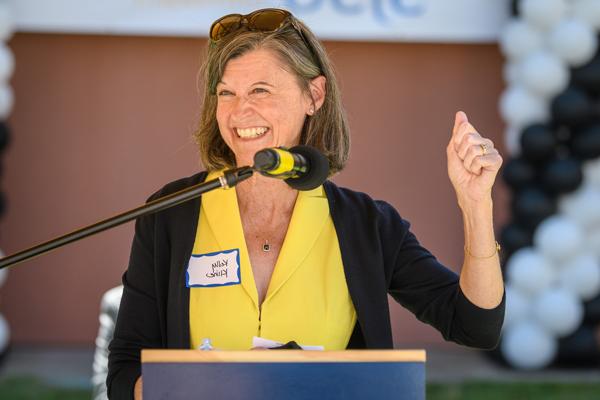 a woman smiling with microphone